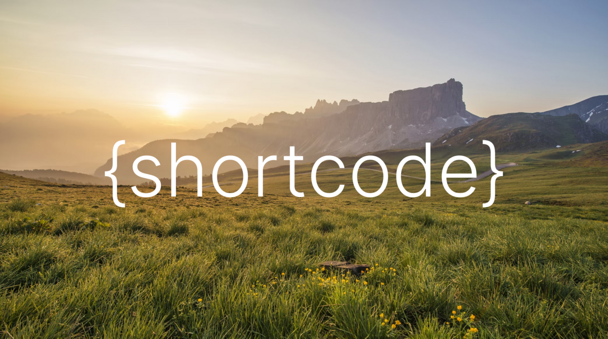 {shortcode} text displayed over a scenic mountain landscape at sunrise, symbolizing reusable content snippets in a natural and inspiring way.