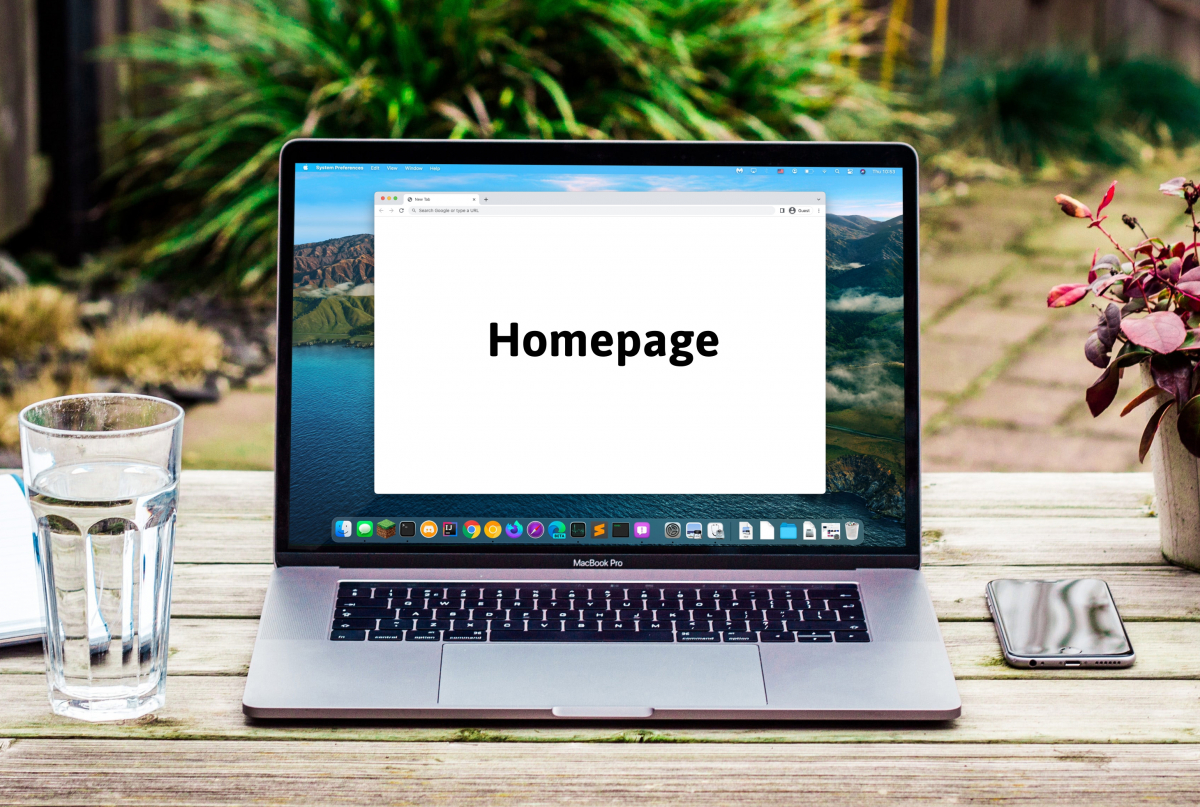 a laptop on top of a rustic desk, outside. With greenery in the background, blurred. There's a full glass of water to the left and an iphone and a pot of a plant to the right.